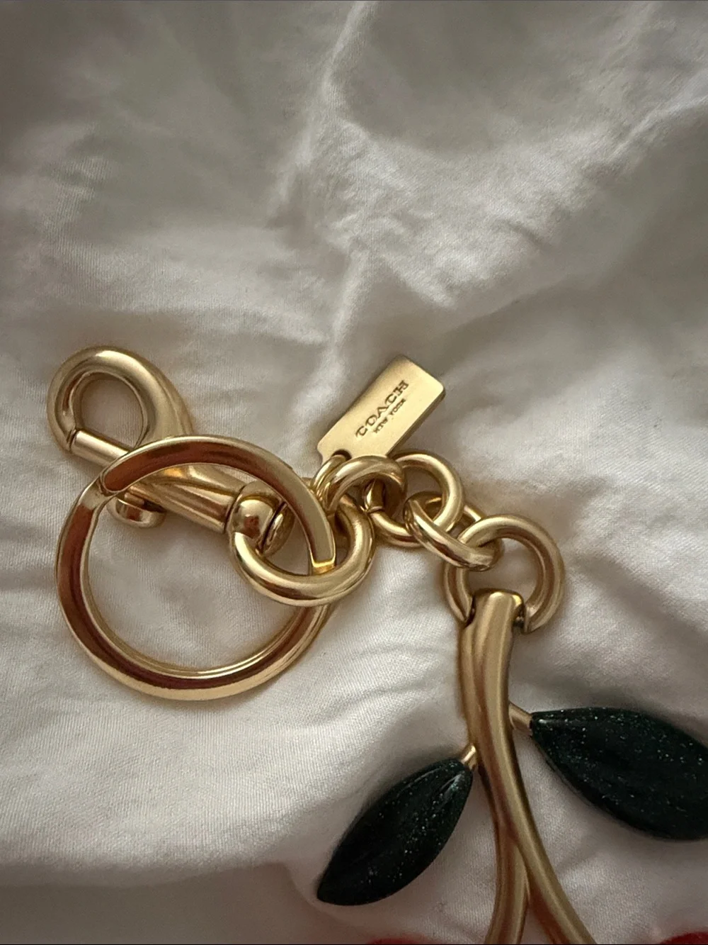 Coach Gold-Tone Pink Cherry Key Charm with Dark Green Leaves